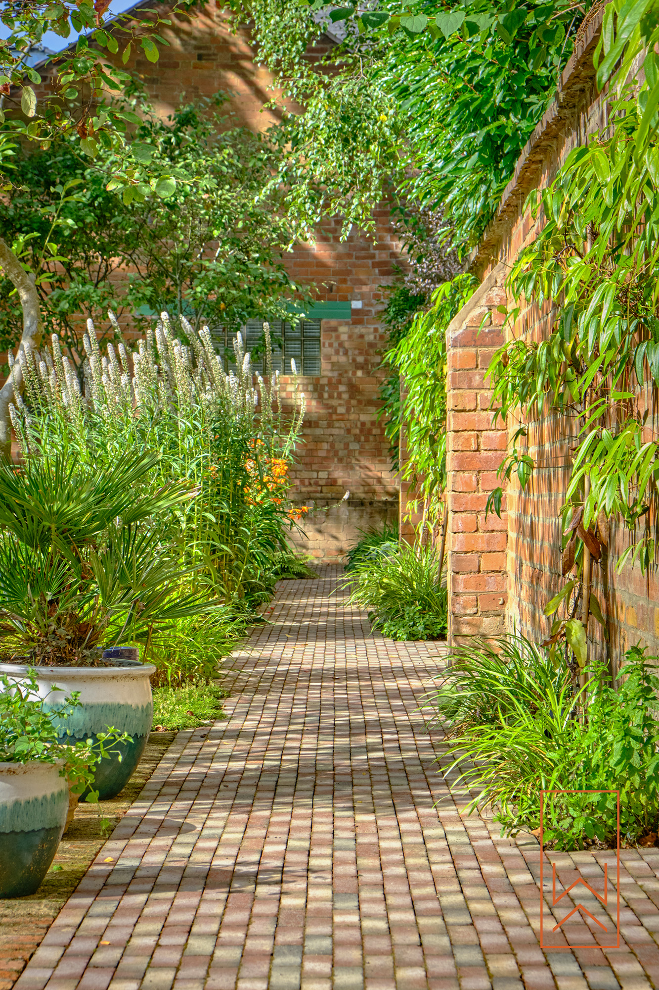 Clay paver path through a walled Victorian garden in Leamington Spa