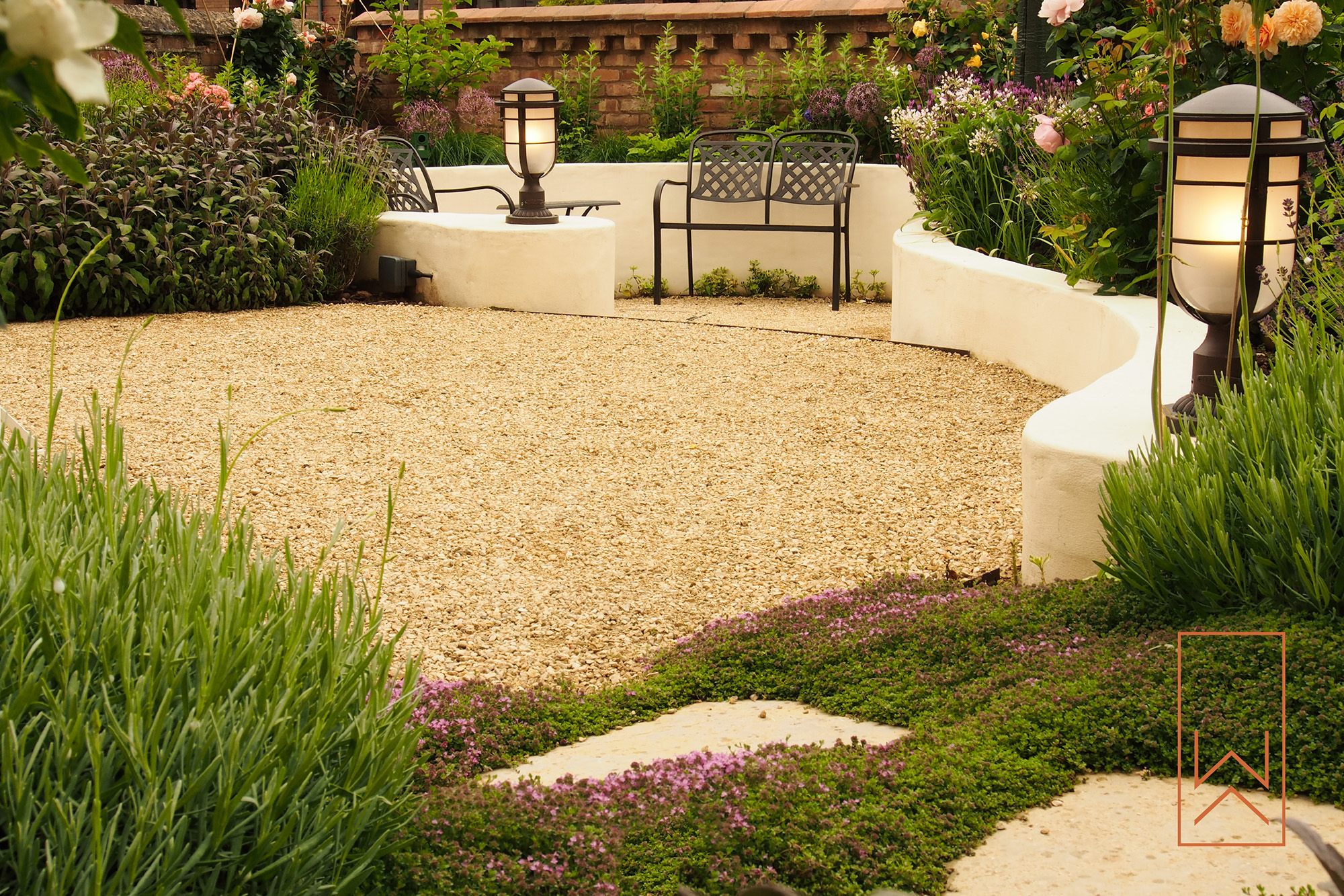 Garden seating with lantern lighting in Mediterranean town garden, Leamington Spa