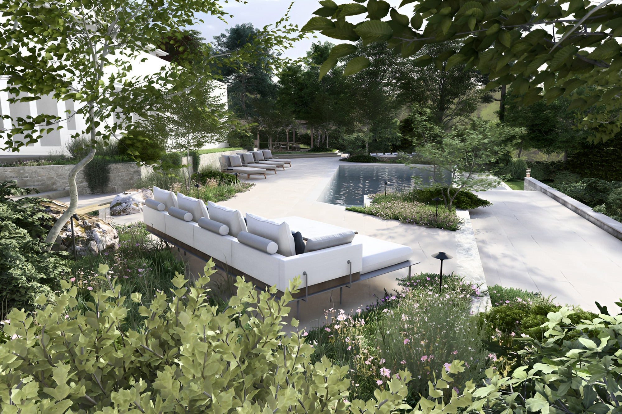 sunken garden seating area with pool and naturalistic planting UK